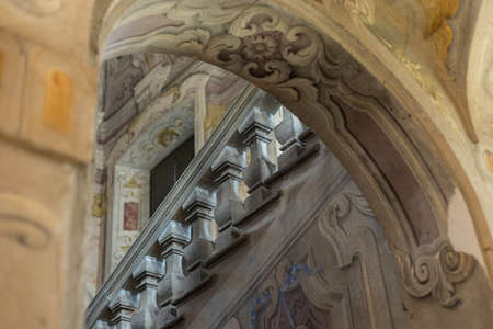 an old vintage beautiful staircase in an antique villa with railingsの写真素材