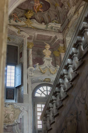 an old vintage beautiful staircase in an antique villa with railingsの写真素材