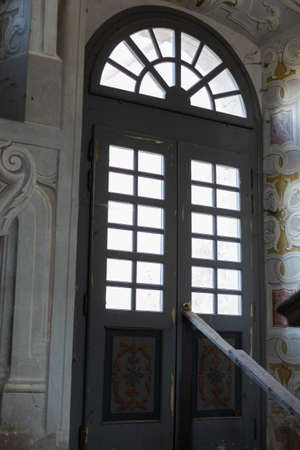 a beautiful vintage wooden door in an old antique villaの写真素材