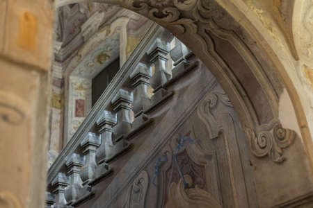 an old vintage beautiful staircase in an antique villa with railingsの写真素材