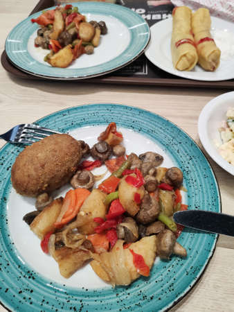 dish with potatoes and a cutlet in a restaurant for lunch