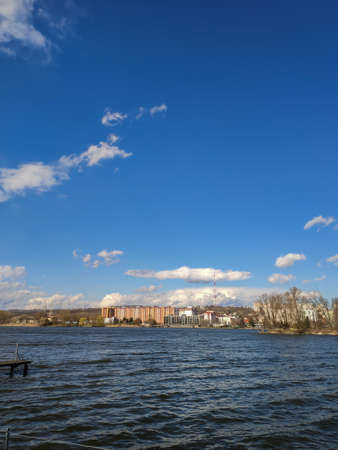 an embankment of the river against the backdrop of the city in the parkの写真素材