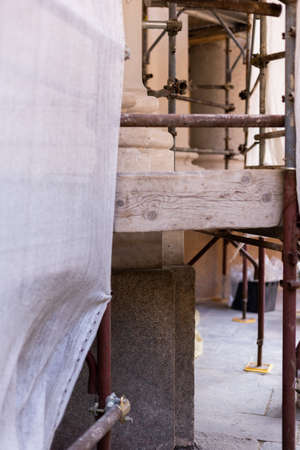 a restoration of an old italian castle with scaffoldingの写真素材