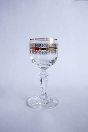a glass shot glass for drinks on a white background