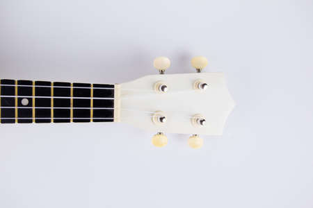 a strings of a beautiful white guitar close-up on a white background ukuleleの写真素材