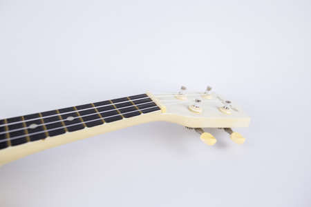 a strings of a beautiful white guitar close-up on a white background ukuleleの写真素材