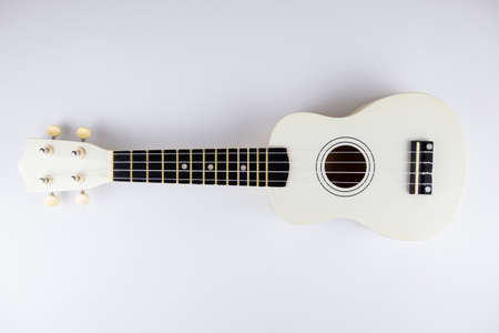 a strings of a beautiful white guitar close-up on a white background ukuleleの写真素材