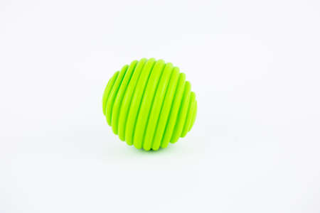 green rubber ball for dog child toy on white backgroundの写真素材