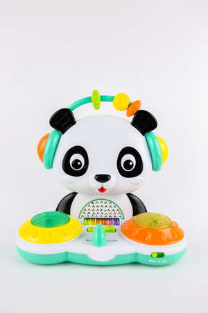a children's toy plastic panda on a white backgroundの写真素材