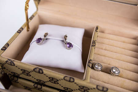 a chest for women's jewelry with earrings with stonesの写真素材
