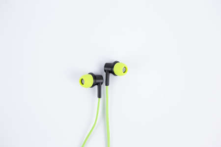 an audio music headphones light green color on a white backgroundの写真素材