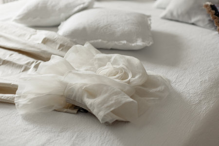 decor on bed in hotel room with pillow and bedの写真素材