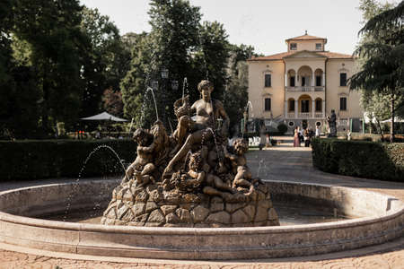 beautiful statue fountain on the territory of the chateau in Italyの写真素材