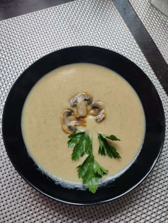 a homemade mushroom soup champignon puree on the tableの写真素材