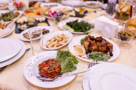 a meat and snacks on the table in the restaurantの写真素材