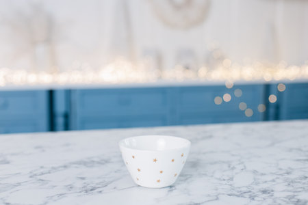 a small white bowl on the kitchen tableの写真素材