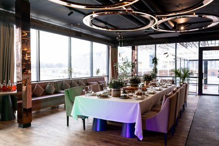a wedding festive table in a restaurant with food and decor