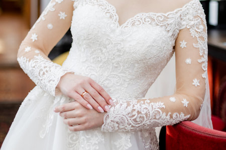 bride in a white wedding dress is waiting for the groom at the ceremonyの写真素材