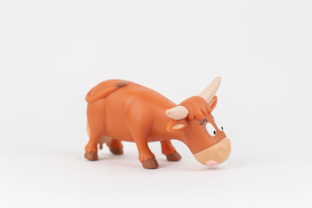 cow figure children's toy on a white backgroundの写真素材