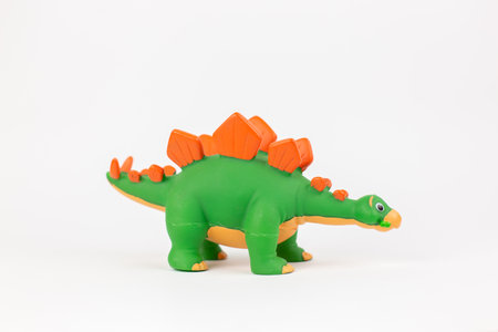 a dinosaur figure children's toy on a white backgroundの写真素材