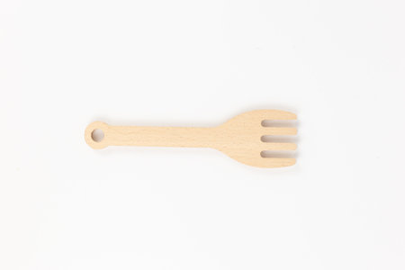 a wooden spatula for cooking on a white backgroundの写真素材