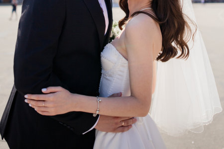 a groom and the bride stand together at the weddingの写真素材