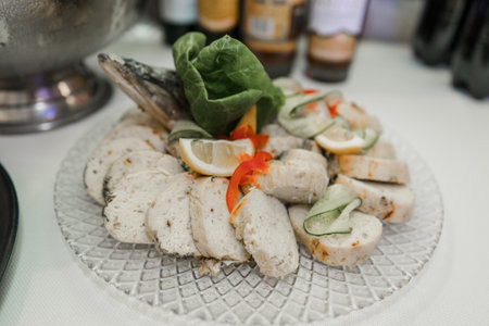 an appetizer food delicacy stuffed fish on a festive table in a restaurantの写真素材