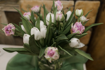 beautiful festive bouquet of flowers in a restaurant on a wedding day of birthの写真素材