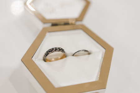 white wooden box for wedding rings on the tableの写真素材