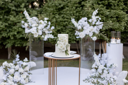 wedding cake near arch for the evening ceremonyの写真素材
