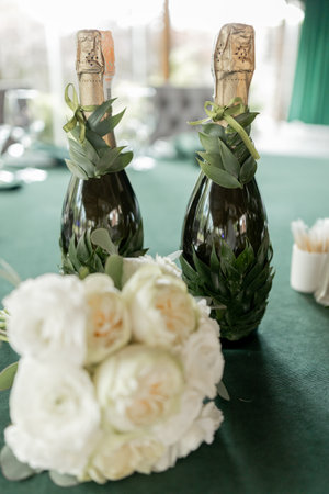wedding bouquet of beautiful flowers on the table in the roomの写真素材