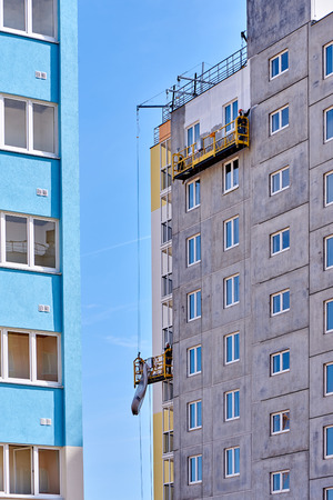 construction of a multi-storey building in a young neighborhoodの写真素材
