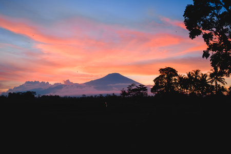 portrait of ciremai mountain scenery and surrounded by thin cloudsの写真素材