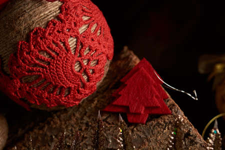 Handmade Christmas decorations: vintage New Year tree toys on a warm wooden background. Cristmas and...