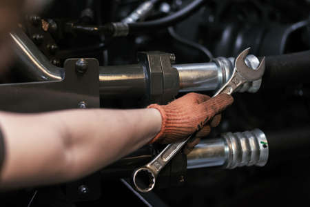 Close up view of hydraulic pipes of heavy industry machine. Low key. Hydraulic maintenance concept.の写真素材