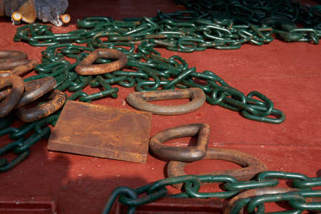 Cargo lashing chains, stoppers and d-rings deck of merchant cargo ship ready for cargo securing