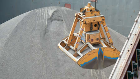 Loading and dischargind operation of bulk cargo bauxite on bulk carrier ship using grab bucket or...