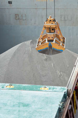 Loading and dischargind operation of bulk cargo bauxite on bulk carrier ship using grab bucket or...