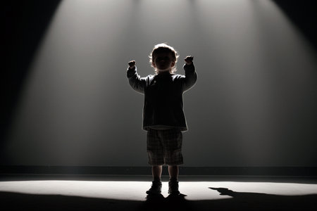 silhouette of a kid in a spotlightの素材