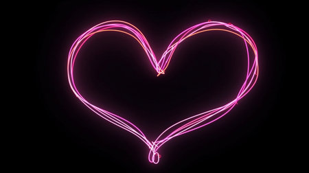 glowing  heart shape on black backgroundの素材