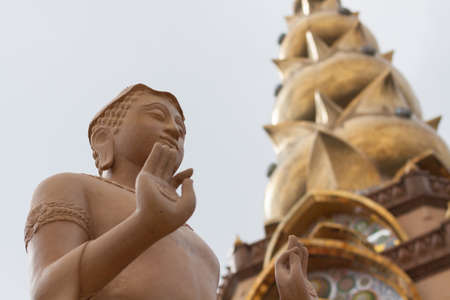 A buddha statue with pagoda at Phasornkaew templeの写真素材