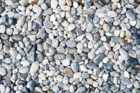 Abstract background of round grey pebble stonesの写真素材