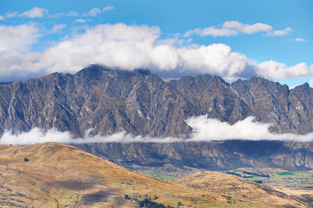 The Remarkables with cloud cover peak, Queenstown, New Zealandの写真素材