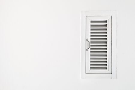 Closed Wooden Door on White Wallの写真素材