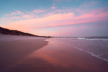 Beautiful summer sunset at Cosy Corner Beach in Albany, Western Australia. Vibrant pink and blue sky with a calm and empty beach.のeditorial素材