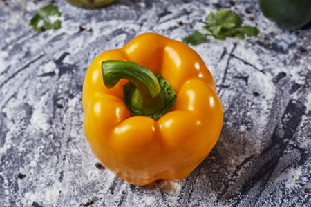 Red green yellow pepper in the kitchen black beautiful backgroundの写真素材