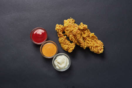 crispy kentucky fried chicken in beauty black backgroundの写真素材