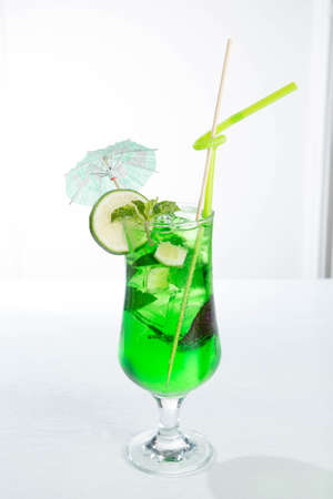 Lemonade tarhun or estragon with ice and lime on white backgroundの写真素材