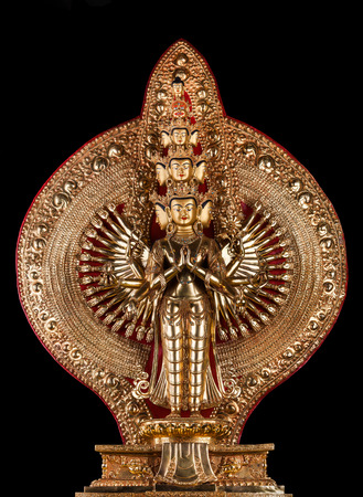 With the thousand arms Avalokiteshvara of a bodhisattva with eleven heads, isolated on a black background.の写真素材