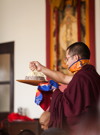 The monk does the Mandala gift during the dedication ceremony at Karmapa institute - KIBI, in Delhi, India. January 25, 2014.のeditorial素材